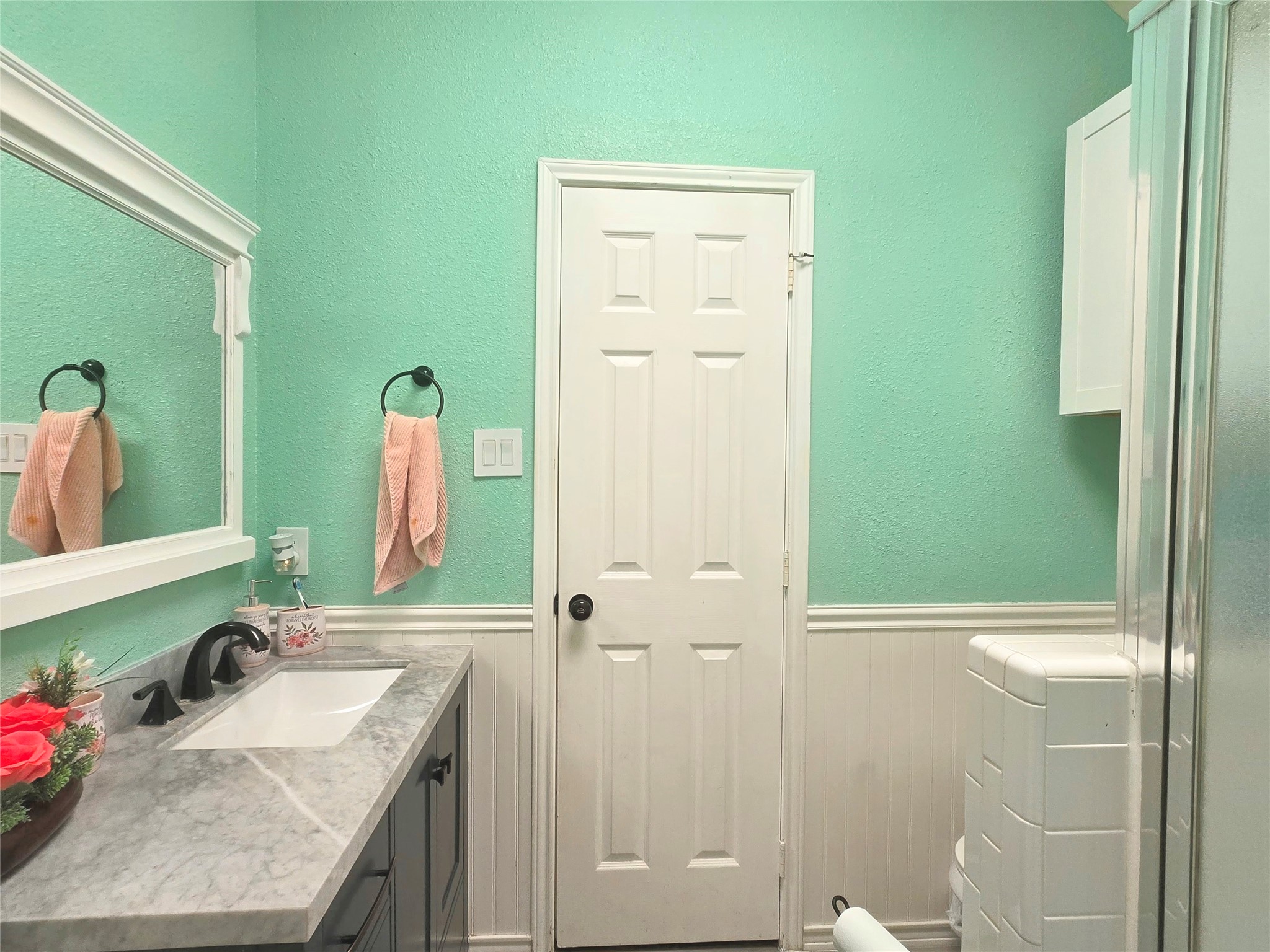 9211 Memorial Grove Drive Spring, TX 77379 - Photo 18 of 38 a bathroom with a granite countertop sink a toilet and shower