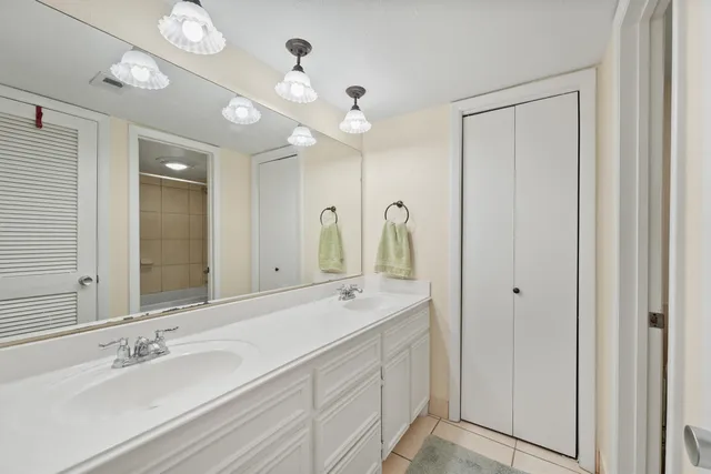 a view of a room with wooden floor and a ceiling fan