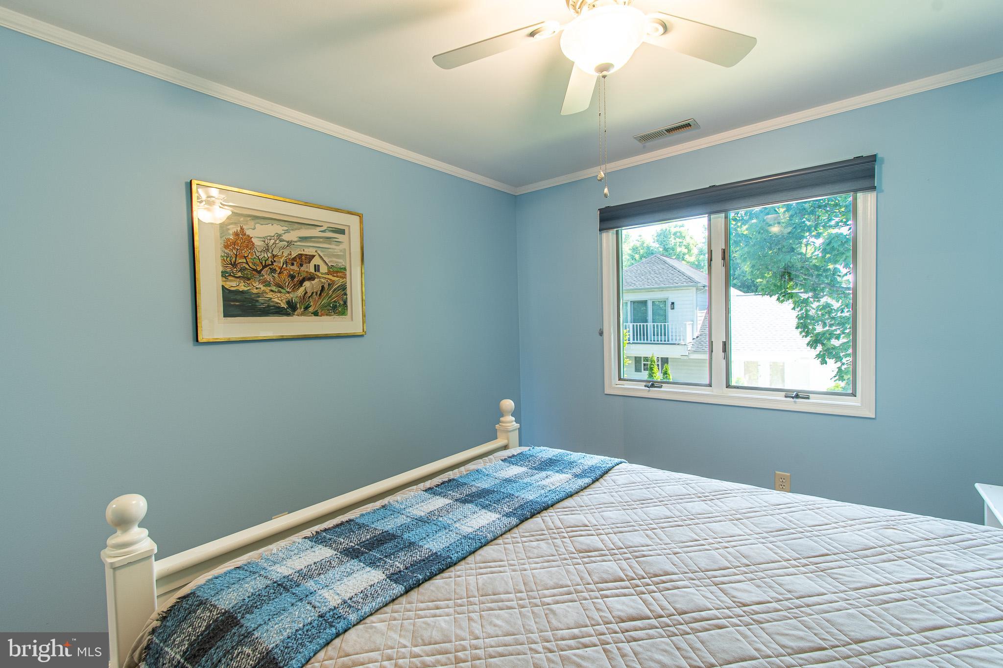 102 Jacks Point Road Oxford, MD 21654 - Photo 33 of 83 a bedroom with bed and window