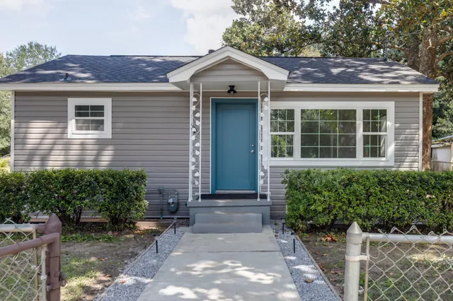 a front view of a house with garden