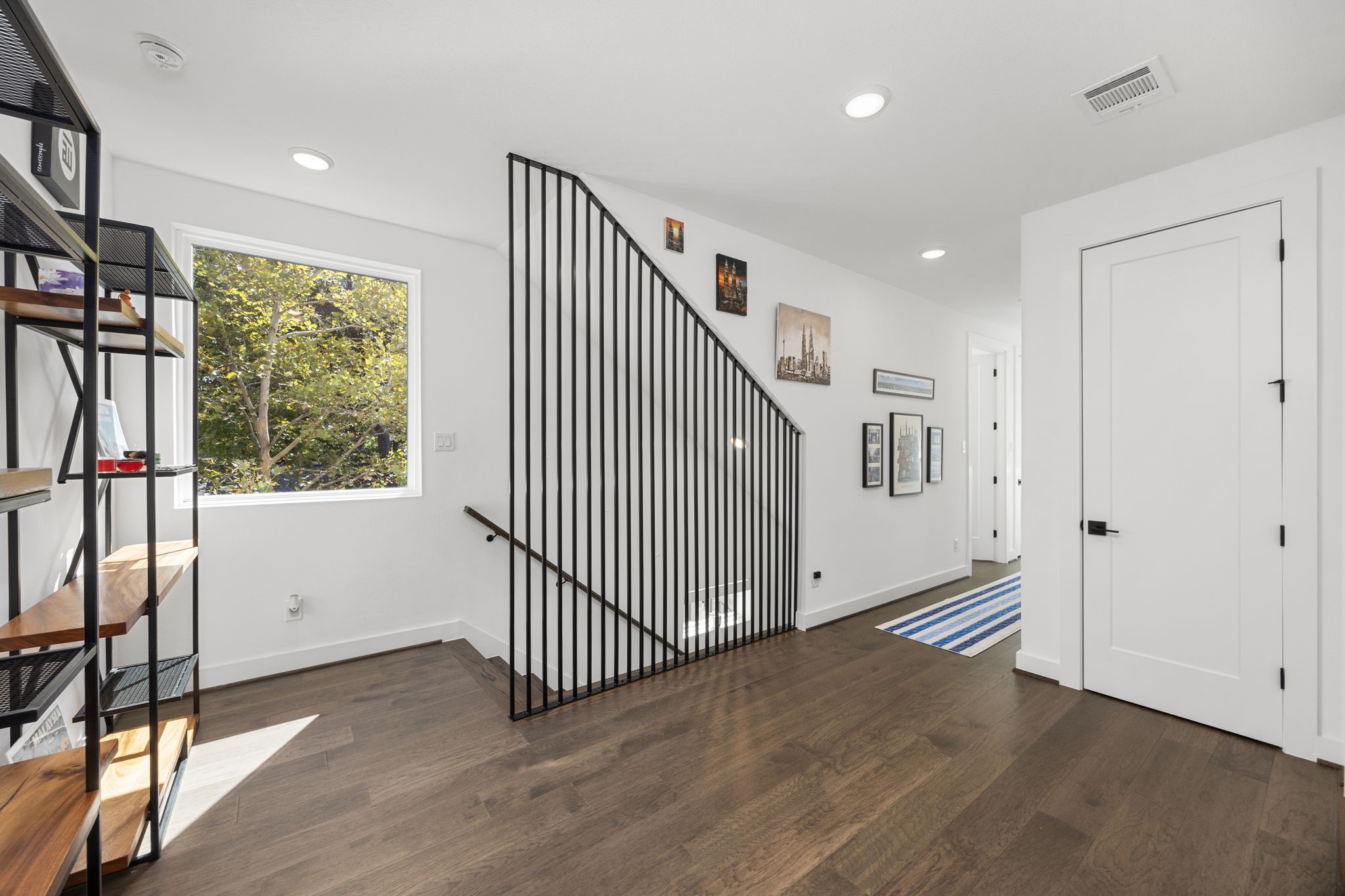 424 Redan Street Houston, TX 77009 - Photo 16 of 47 Upstairs landing, picture window, extra closet space.