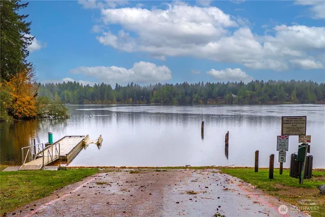 a backyard of a house with yard and outdoor seating