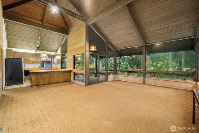 a view of an empty room with a balcony