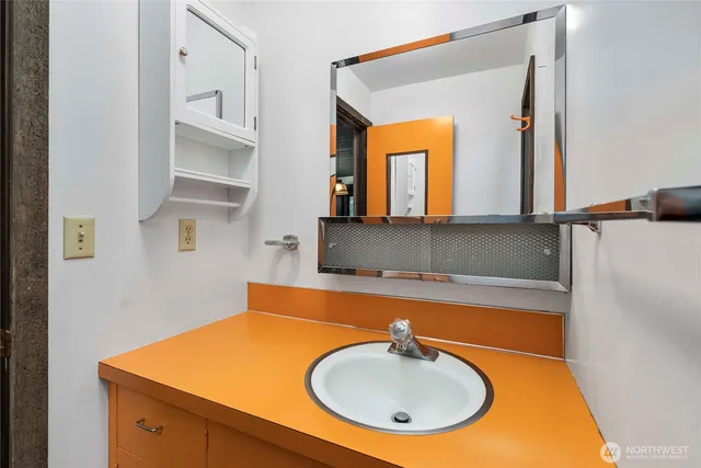 a bathroom with a sink and a mirror