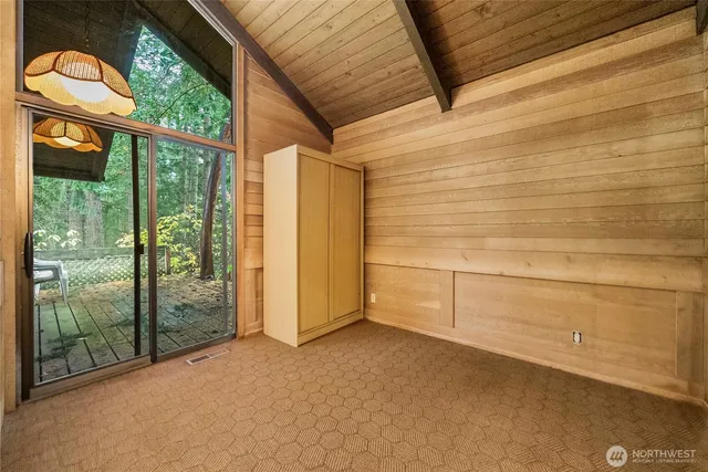 a view of a room with sliding door and wooden floor
