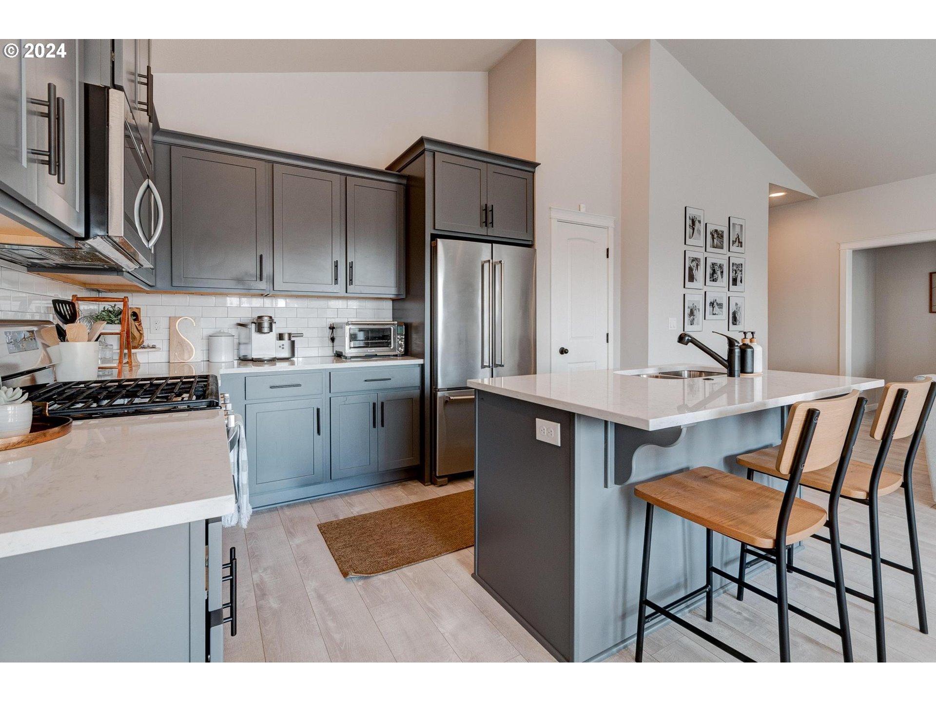 514 Merlot Street Amity, OR 97101 - Photo 14 of 33 a kitchen with stainless steel appliances a sink a table and chairs