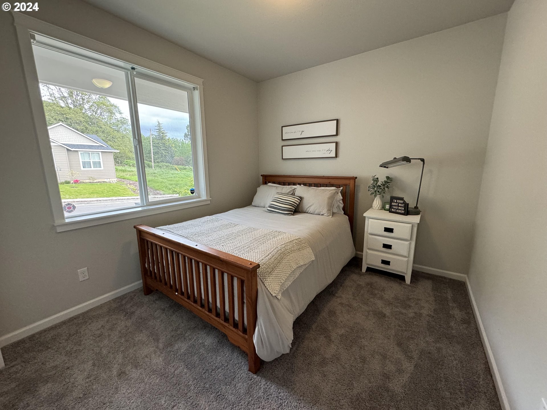 514 Merlot Street Amity, OR 97101 - Photo 23 of 33 a bedroom with a bed and a window