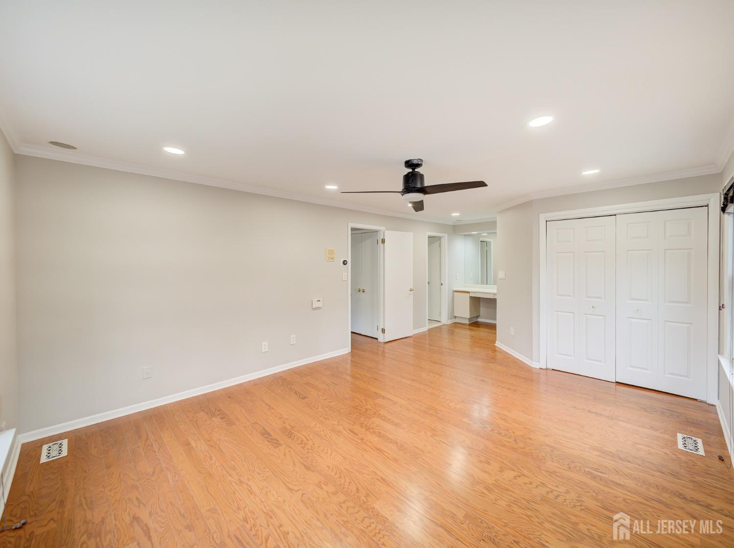 4905 Stonehedge Road Edison, NJ 08820 - Photo 26 of 43 a view of an empty room with a window