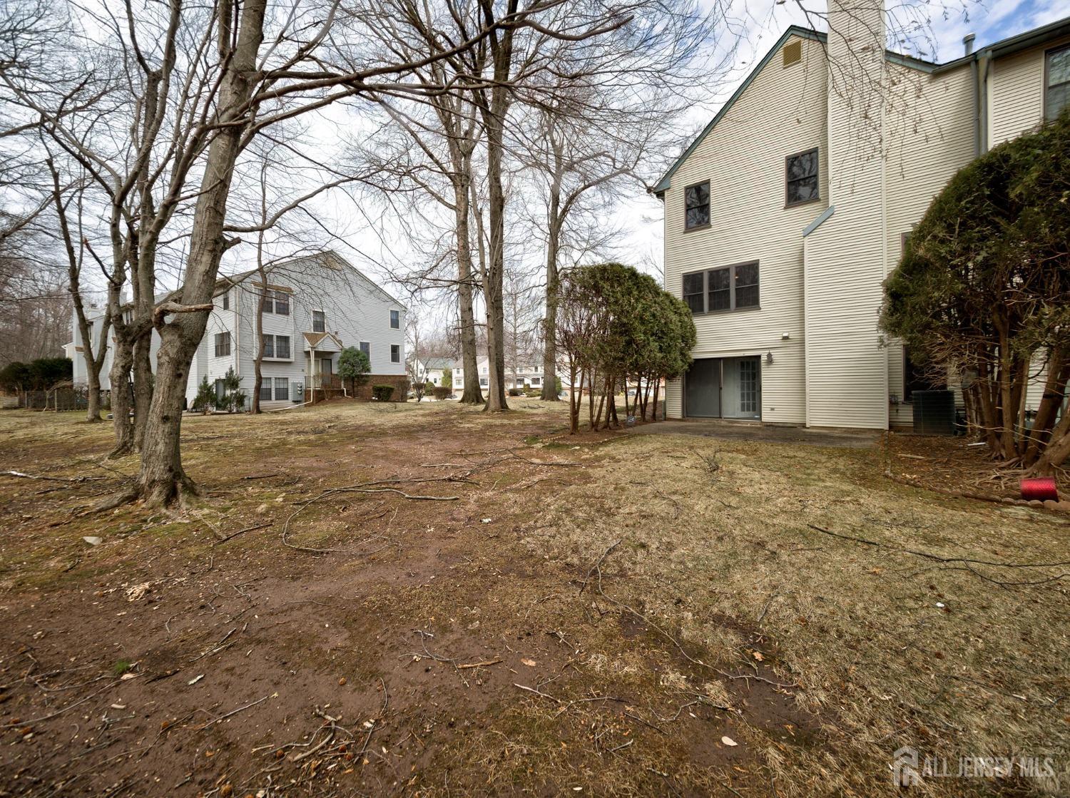 4905 Stonehedge Road Edison, NJ 08820 - Photo 38 of 43 a front view of a house with a yard