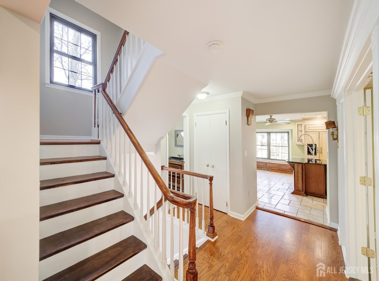 4905 Stonehedge Road Edison, NJ 08820 - Photo 10 of 43 a view of entryway with wooden floor and a front door