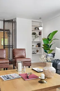 a living room with furniture and a rug