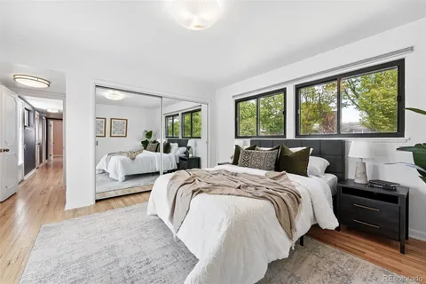 a bed room with bed and a large window