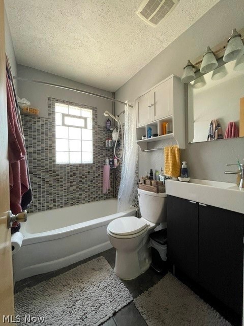 28634 Forest Road Willowick, OH 44095 - Photo 26 of 39 Bathroom featuring a built-in tub with a mosaic tile surround, a block glass window, and a dark vanity with an integrated sink