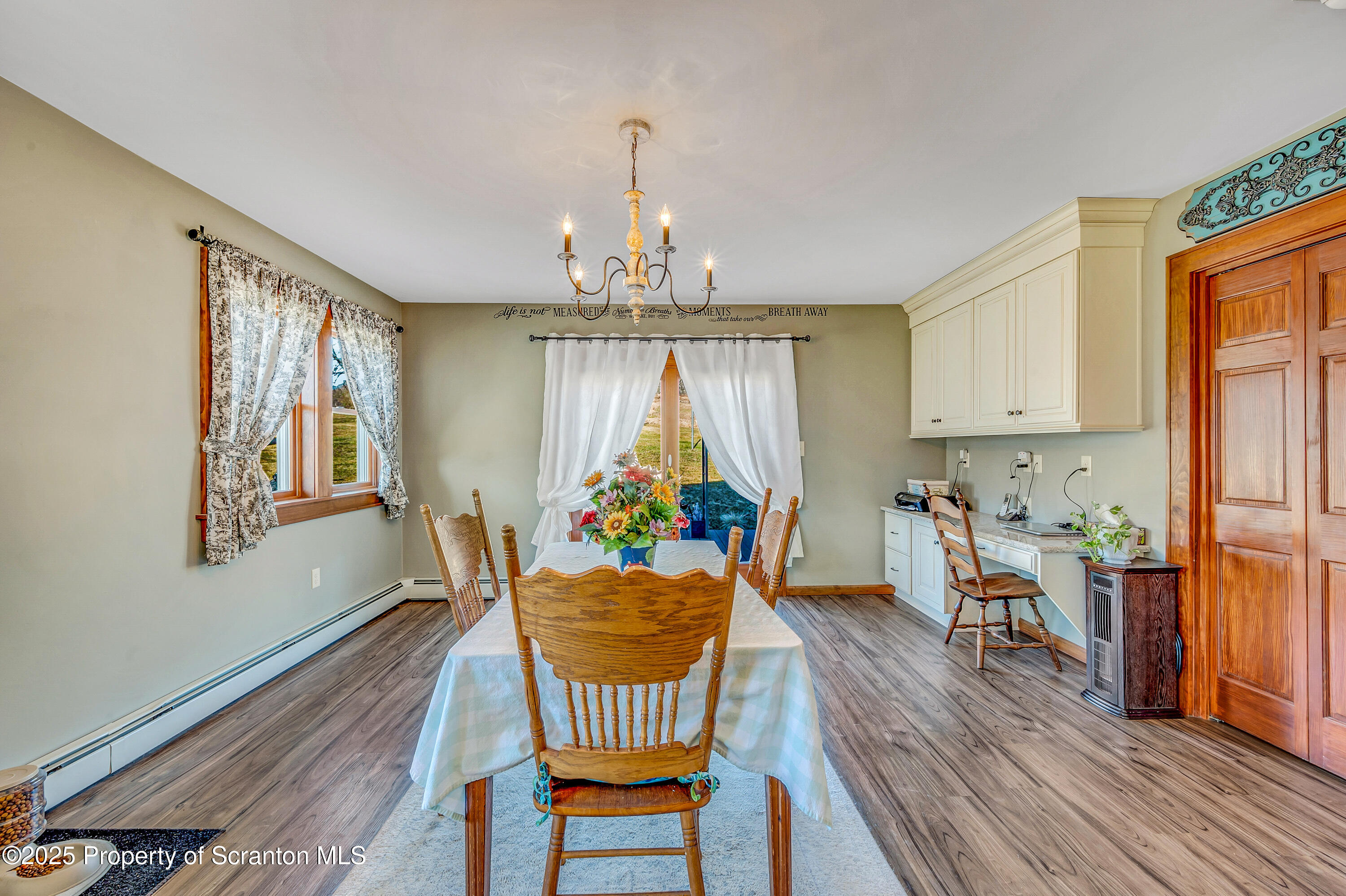 5115 State Rte 3013 Springville, PA 18844 - Photo 39 of 74 a living room with furniture a dining table and a window
