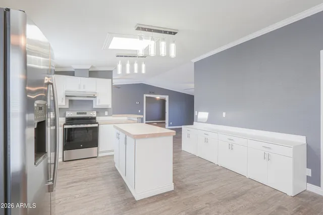 a kitchen with a stove oven and a refrigerator