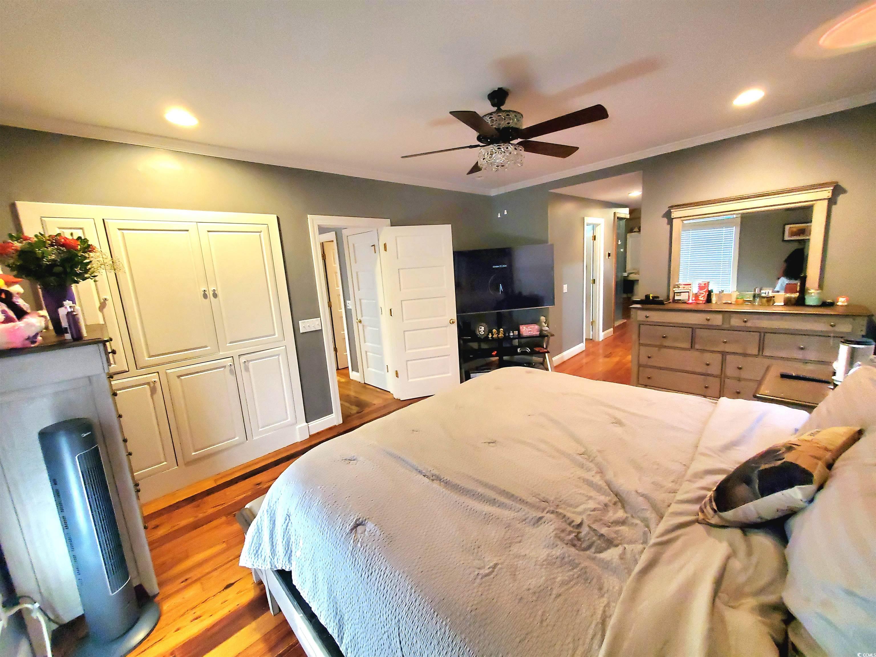 1484 Fitch Road Lake City, SC 29560 - Photo 20 of 40 Bedroom with ornamental molding, light wood-style floors, recessed lighting, and a ceiling fan