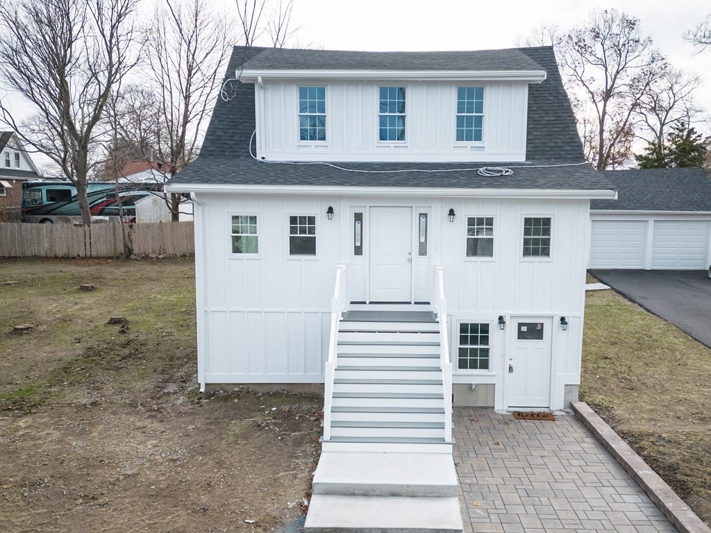 12 Hills Street Randolph, MA 02368 - Photo 1 of 28 a view of a white house with a large windows