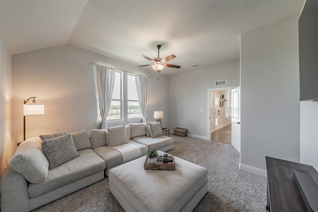 2230 County Road 2360 Decatur, TX 76234 - Photo 19 of 40 Great size primary suite equipped with an electric fireplace & cedar plank mantel