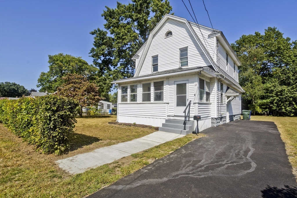 69 Merrimac Avenue Springfield, MA 01104 - Photo 30 of 42 a view of a house with backyard and trees