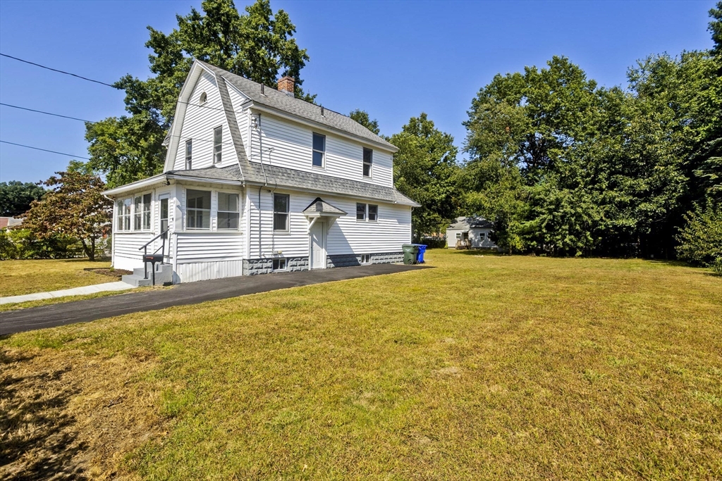 69 Merrimac Avenue Springfield, MA 01104 - Photo 32 of 42 a front view of a house with swimming pool