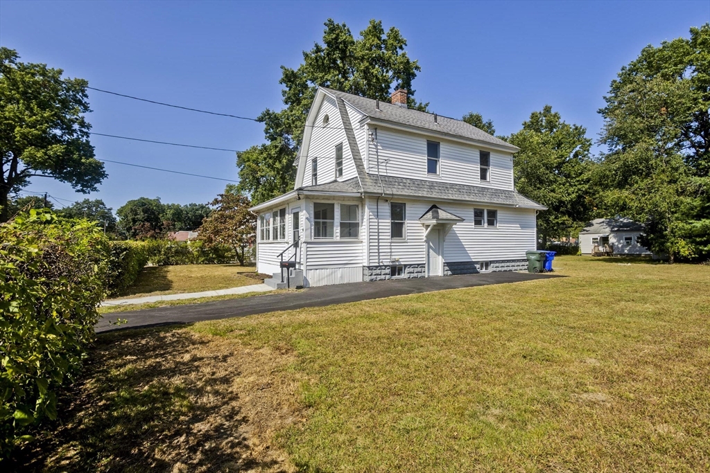 69 Merrimac Avenue Springfield, MA 01104 - Photo 33 of 42 a front view of a house with swimming pool