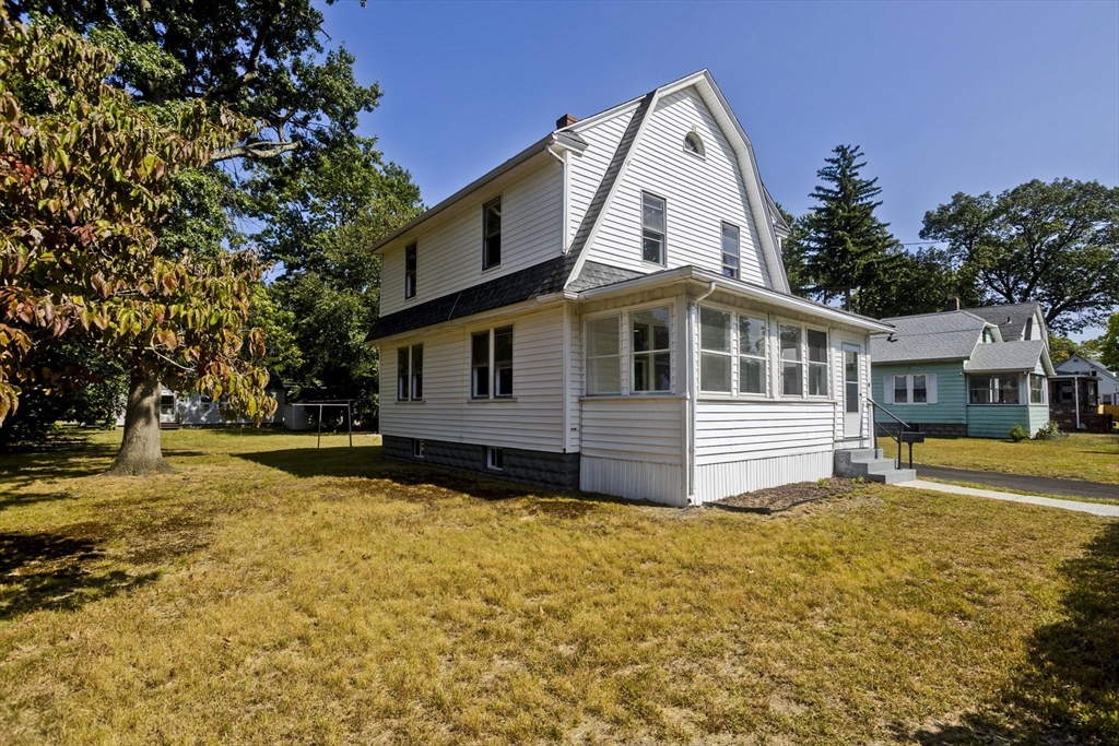 69 Merrimac Avenue Springfield, MA 01104 - Photo 36 of 42 a view of a house with a yard