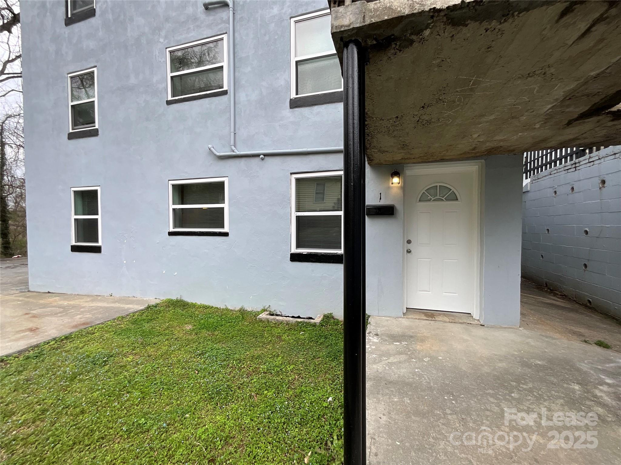 259 Jefferson Court Northeast, Unit 1 Concord, NC 28025 - Photo 1 of 9 a view of a backyard of a house