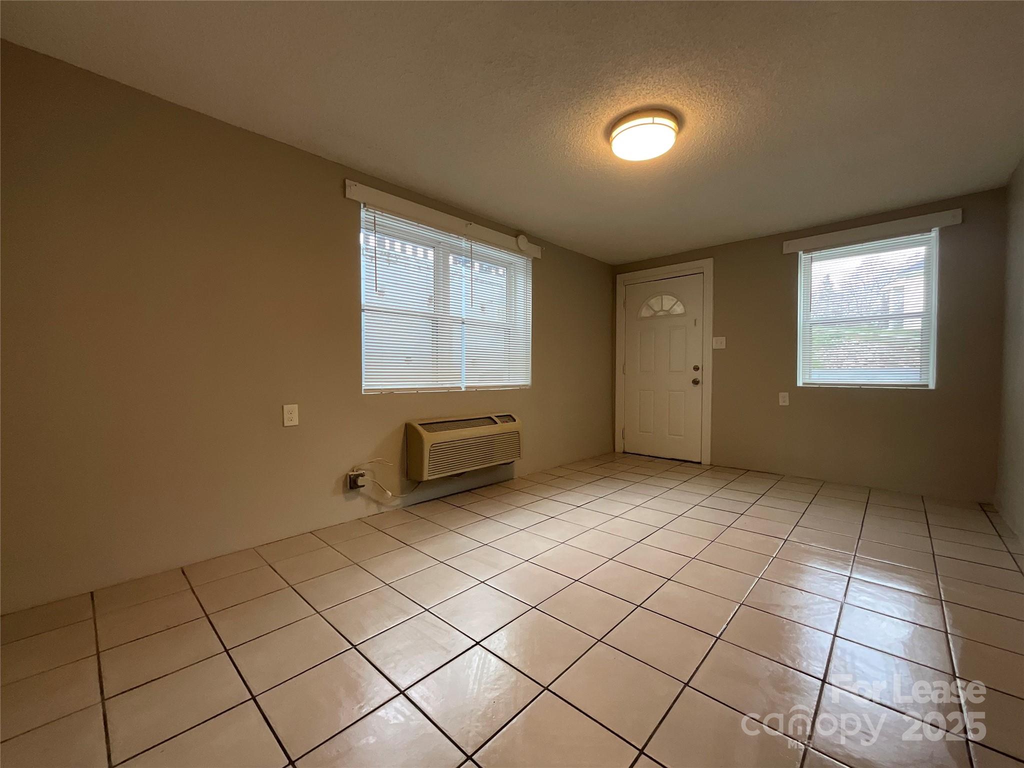 259 Jefferson Court Northeast, Unit 1 Concord, NC 28025 - Photo 3 of 9 a view of room and window