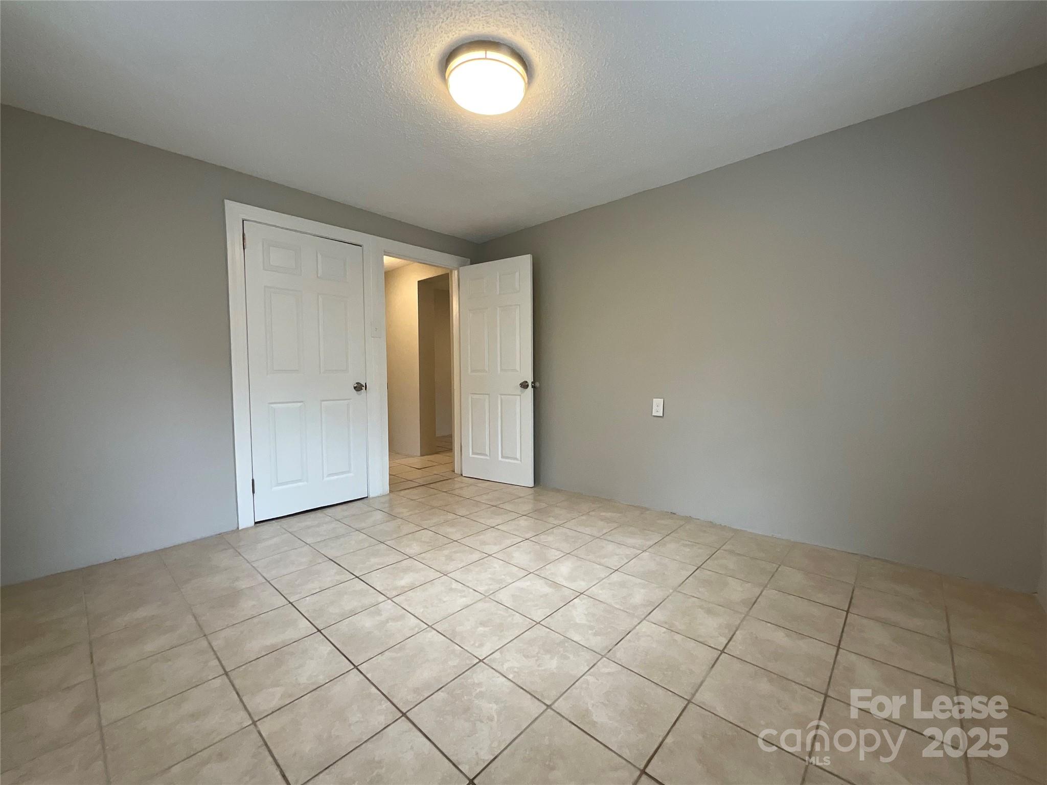 259 Jefferson Court Northeast, Unit 1 Concord, NC 28025 - Photo 9 of 9 a view of an empty room and window