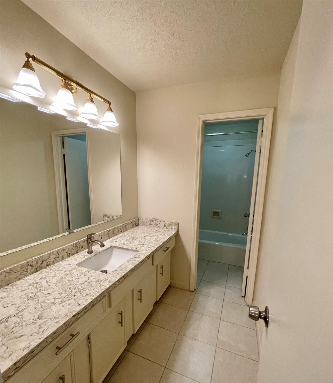 11632 South Kirkwood Road Houston, TX 77477 - Photo 18 of 21 a bathroom with a granite countertop sink and a mirror