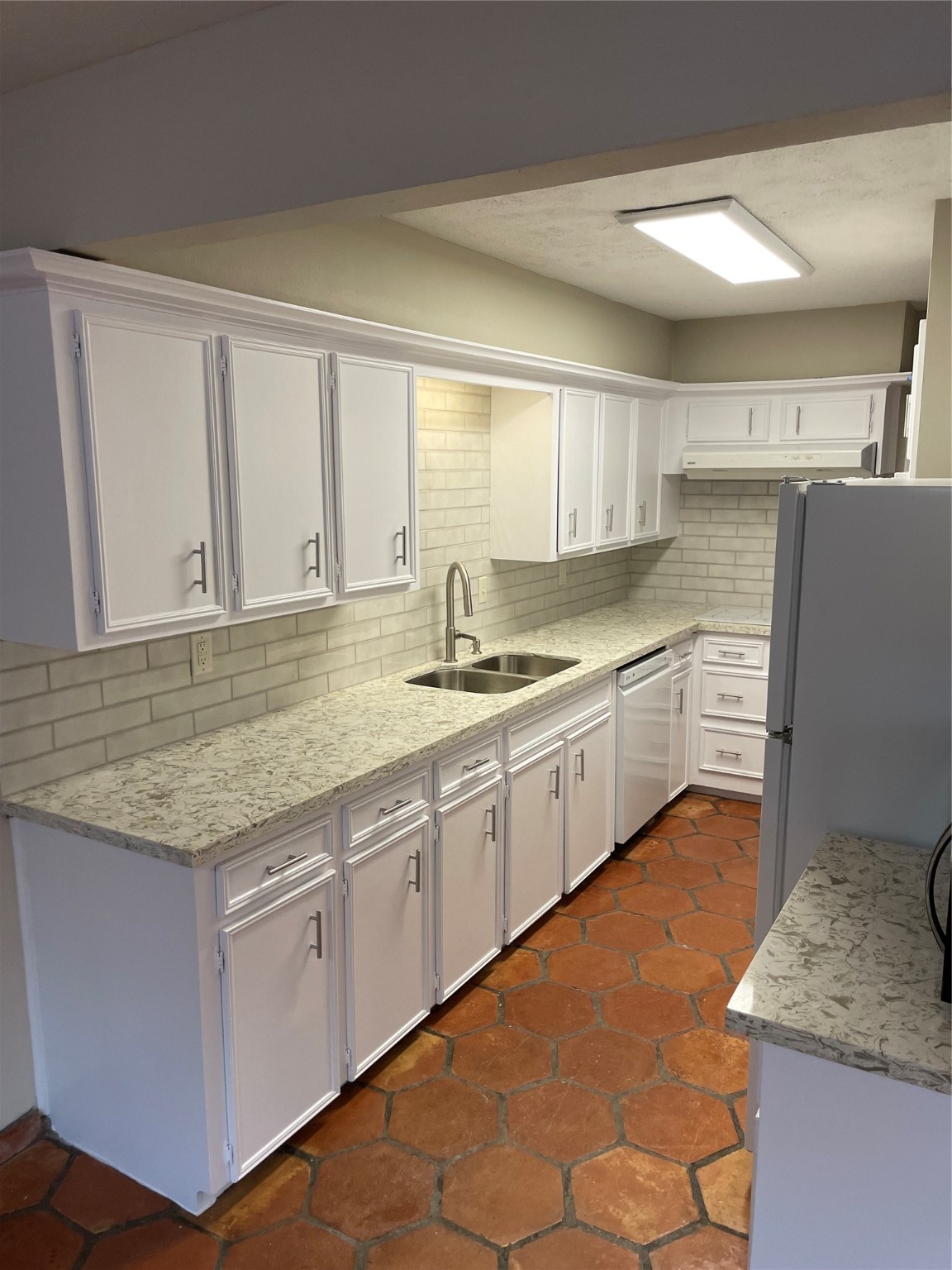 11632 South Kirkwood Road Houston, TX 77477 - Photo 9 of 21 a kitchen with stainless steel appliances granite countertop a stove a sink and a refrigerator