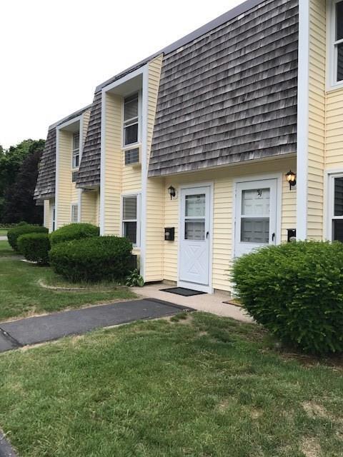 127 Black Point Road, Unit 33 East Lyme, CT 06357 - Photo 1 of 1 a view of a house with a yard and plants