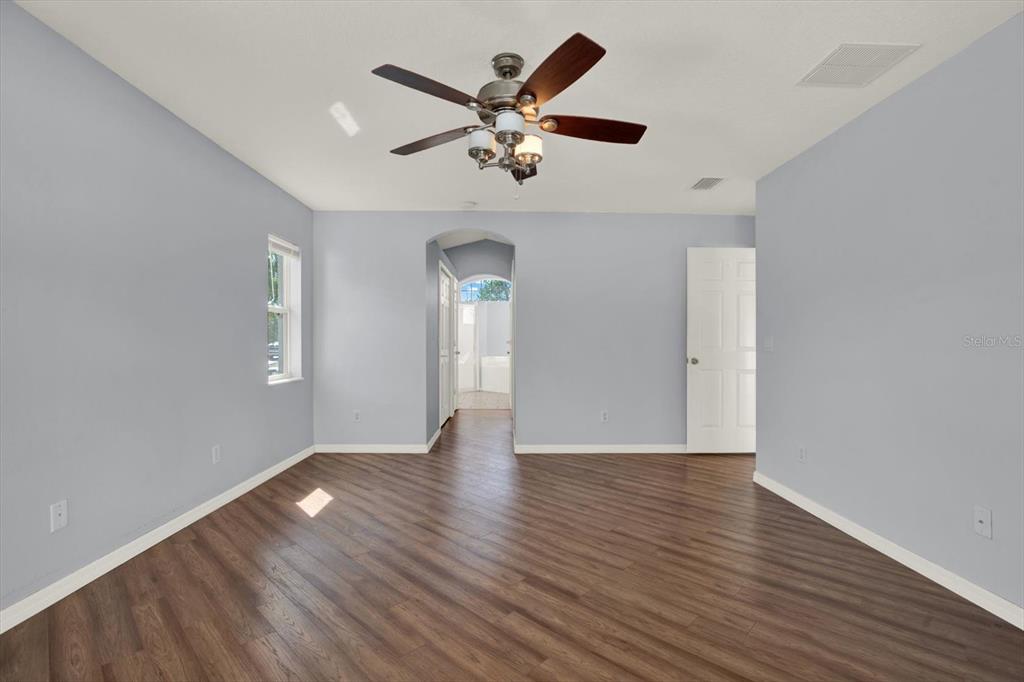 4400 Dior Road Spring Hill, FL 34609 - Photo 22 of 37 a view of an empty room with wooden floor