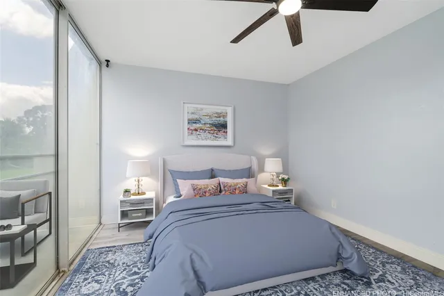 a bedroom with a bed and glass door