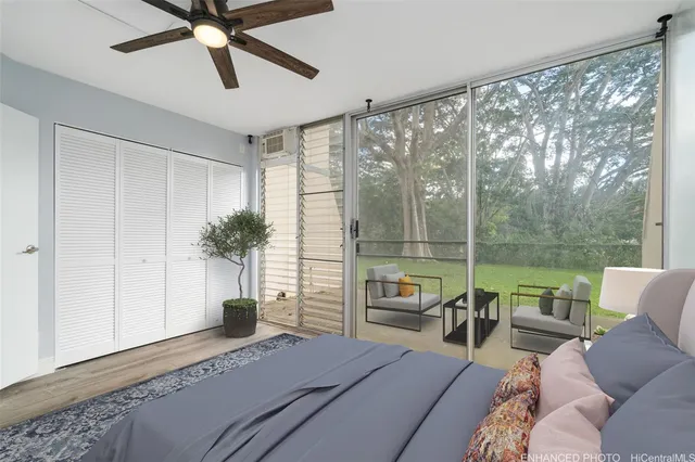 a bedroom with furniture and a large window