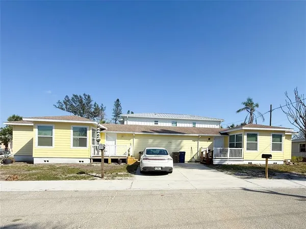 a front view of a house with parking space