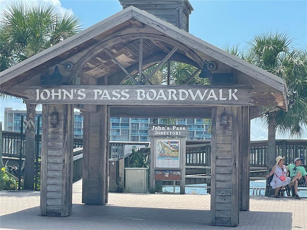 175 133rd Avenue East Madeira Beach, FL 33708 - Photo 12 of 15 a front view of a building with glass windows and door