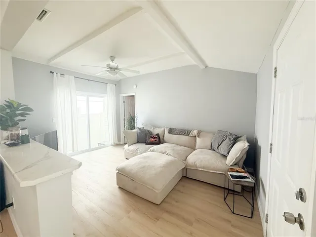 a living room with furniture and a window