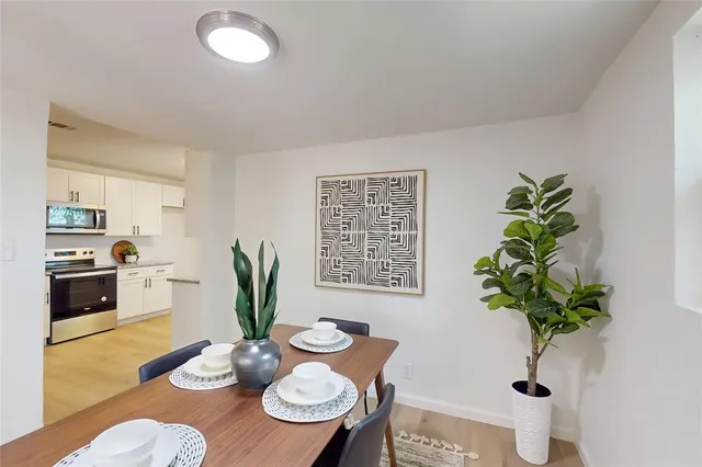 a view of a livingroom with furniture and a window