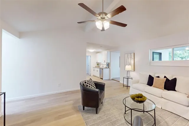 a view of a livingroom with furniture and a chandelier
