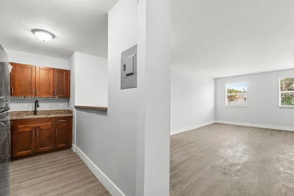 a view of a kitchen with a sink cabinets and a window