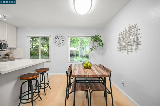 a view of a dining room with furniture window and outside view