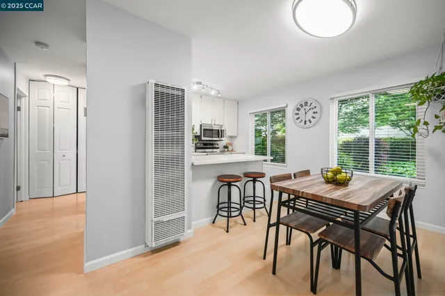 a view of a dining room with furniture and window