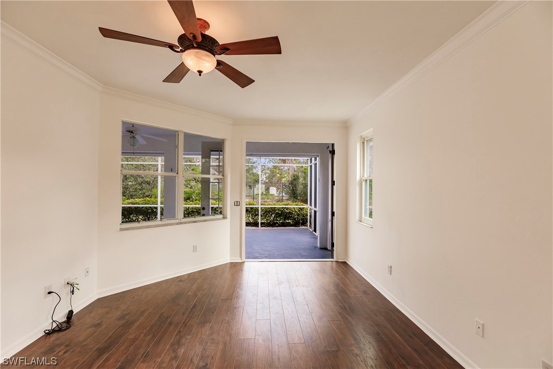 20600 Rivers Ford Estero, FL 33928 - Photo 13 of 28 an empty room with wooden floor fan and windows