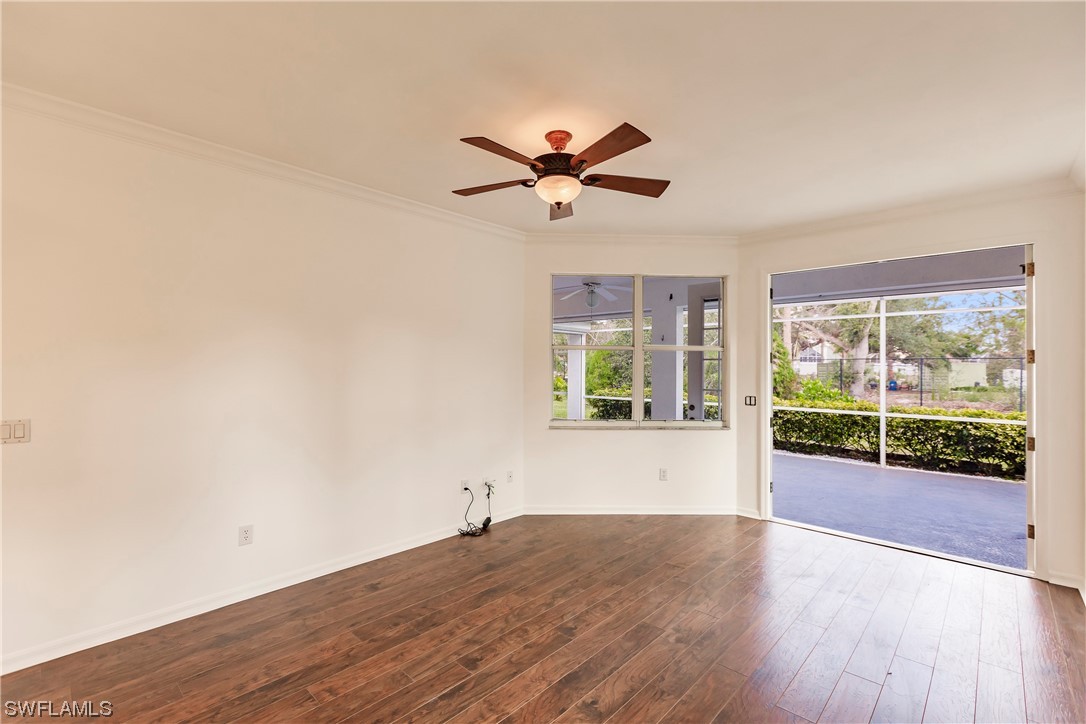 20600 Rivers Ford Estero, FL 33928 - Photo 14 of 28 a view of a livingroom with wooden floor and a ceiling fan