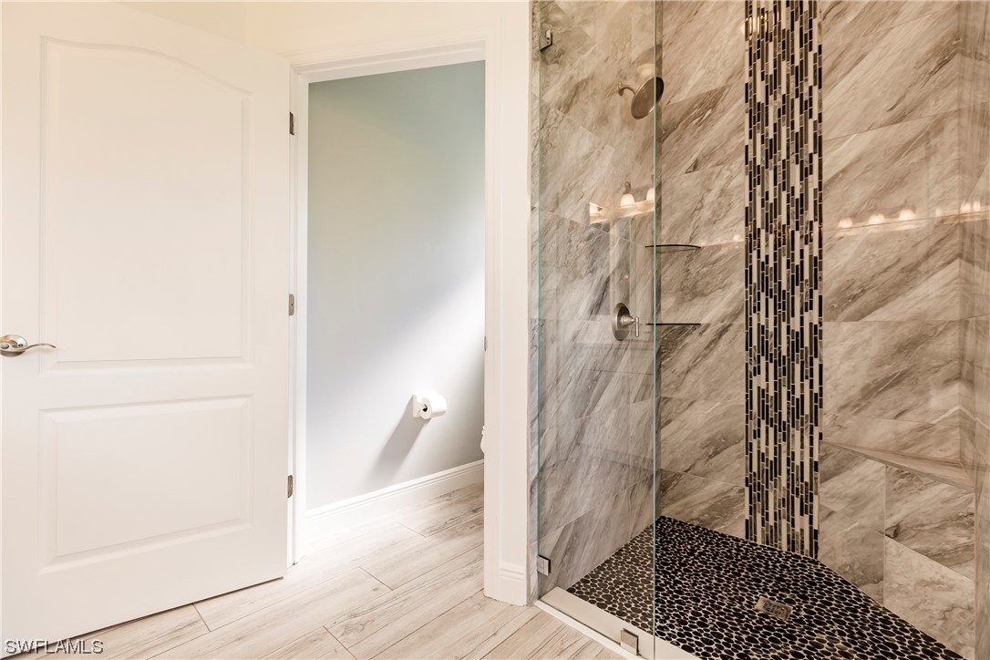 20600 Rivers Ford Estero, FL 33928 - Photo 17 of 28 a bathroom with a shower