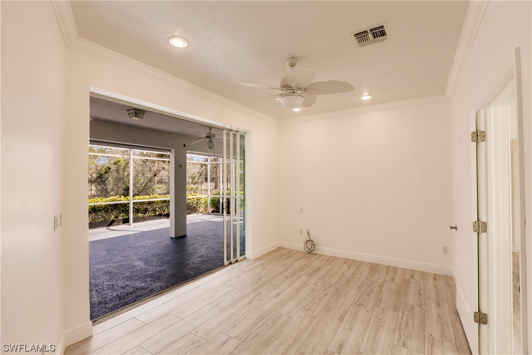 20600 Rivers Ford Estero, FL 33928 - Photo 18 of 28 wooden floor in an empty room with a window