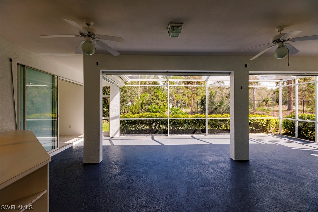 20600 Rivers Ford Estero, FL 33928 - Photo 24 of 28 a view of a room with gym equipment and a large window