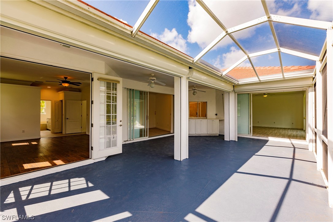 20600 Rivers Ford Estero, FL 33928 - Photo 26 of 28 a view of a hallway with wooden floor and staircase