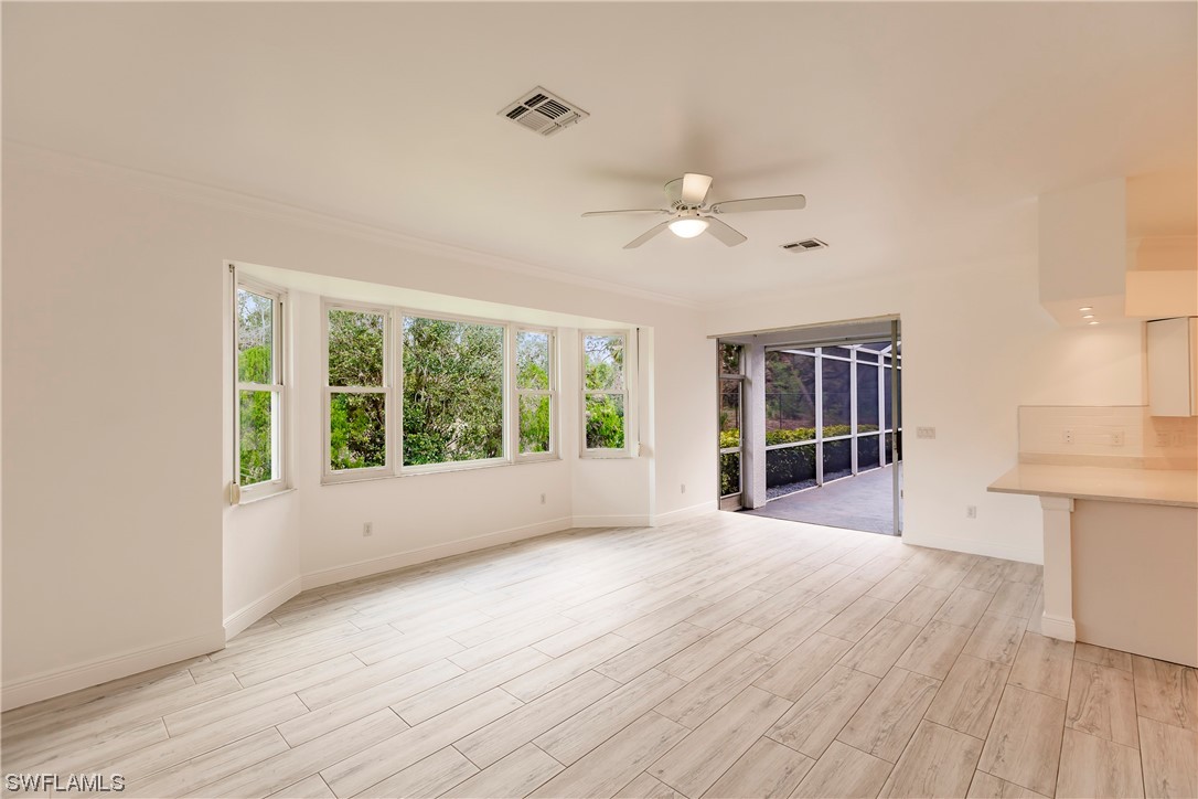 20600 Rivers Ford Estero, FL 33928 - Photo 10 of 28 a view of an empty room with a window and wooden floor